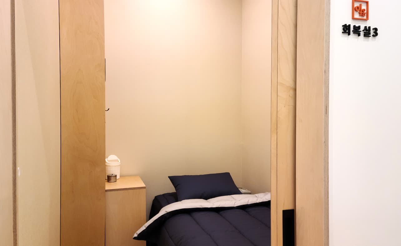 Private recovery room with a bed